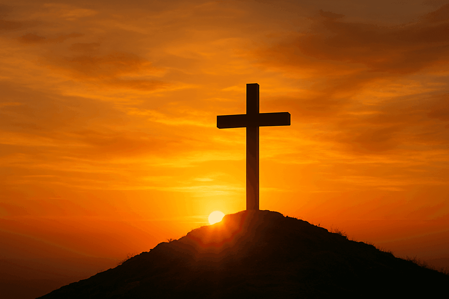 La cruz silueteada por la luz del atardecer que simboliza la redención y la esperanza